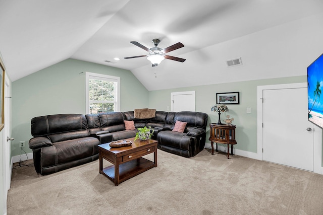 carpeted living room with ceiling fan and lofted ceiling