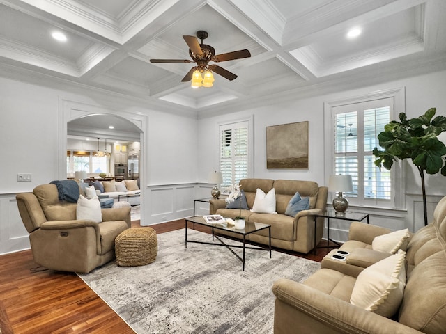 living room with ceiling fan, beam ceiling, and crown molding