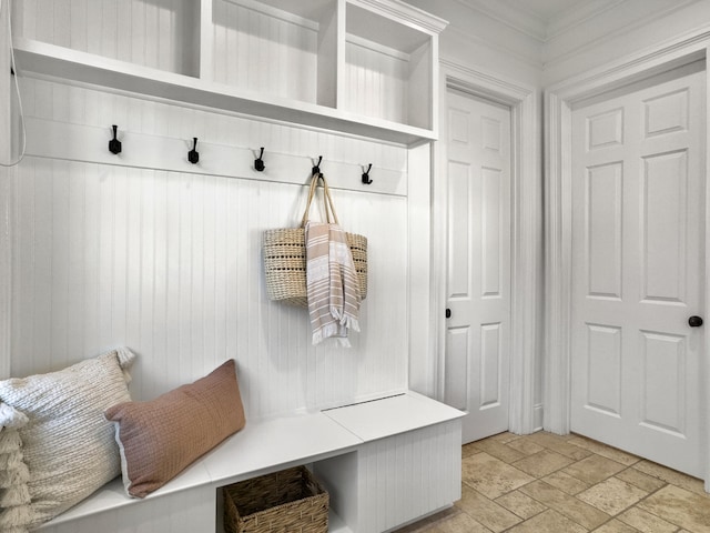 mudroom with wood walls