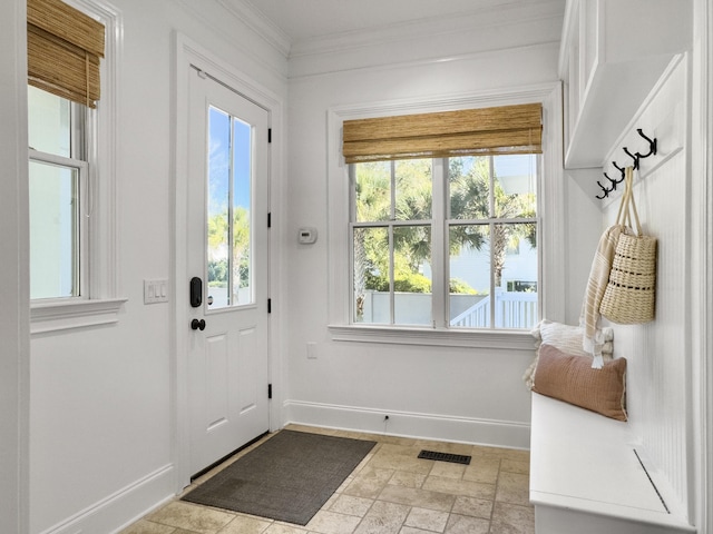 doorway to outside with a water view, a healthy amount of sunlight, and ornamental molding