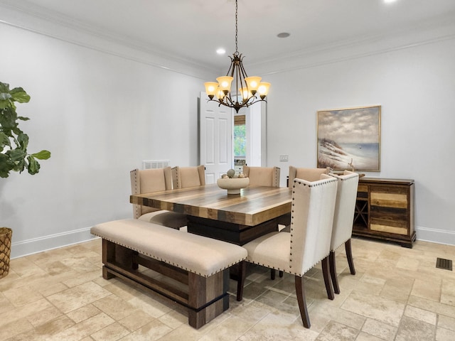 dining area featuring a notable chandelier and ornamental molding