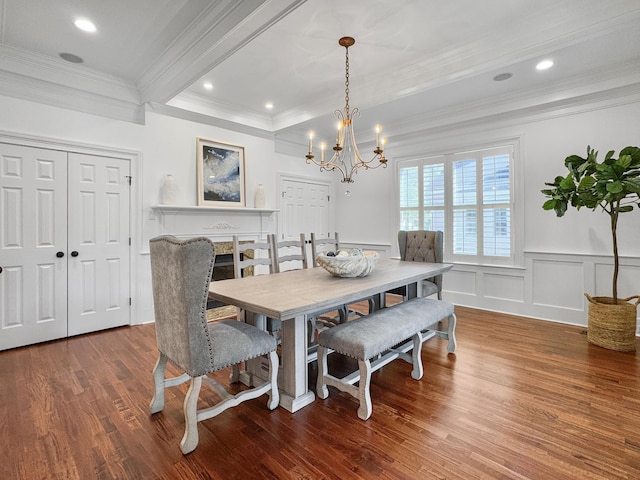 dining room with ornamental molding, beamed ceiling, wood-type flooring, and an inviting chandelier