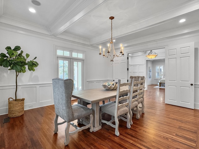 dining space with beamed ceiling, dark hardwood / wood-style flooring, a chandelier, and crown molding