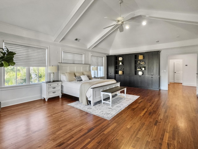 bedroom featuring ceiling fan, dark hardwood / wood-style flooring, and lofted ceiling with beams