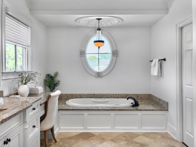 bathroom with a washtub and vanity