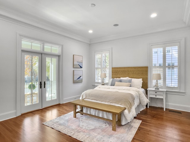 bedroom featuring french doors, access to outside, multiple windows, and dark wood-type flooring