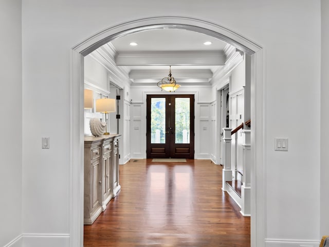 foyer entrance featuring crown molding, french doors, and dark hardwood / wood-style floors