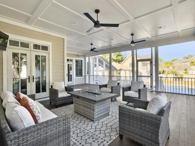 sunroom with french doors and coffered ceiling