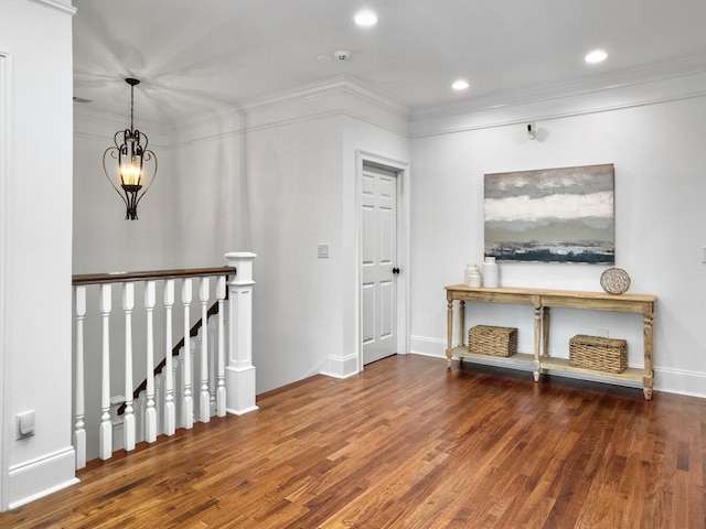 hall featuring crown molding and dark wood-type flooring