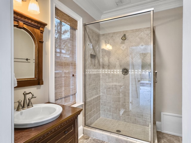 bathroom with tile patterned floors, vanity, ornamental molding, and walk in shower