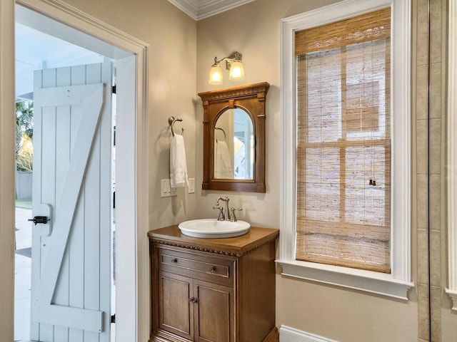 bathroom with vanity and ornamental molding