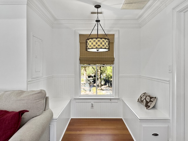 interior space featuring hardwood / wood-style floors and crown molding