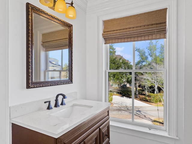 bathroom featuring vanity and crown molding