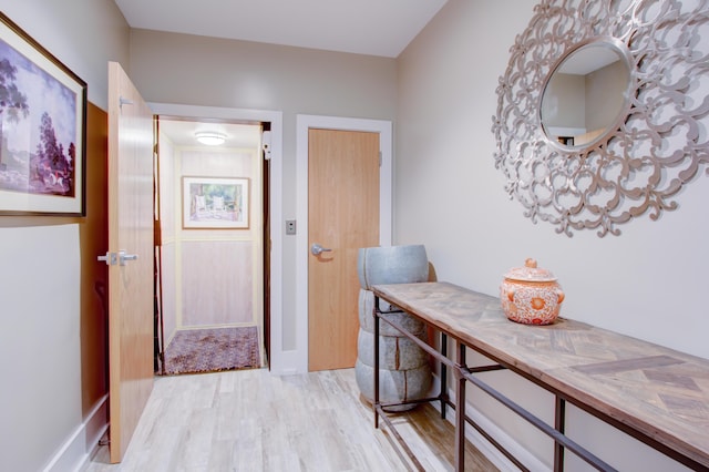 hallway with light wood-type flooring