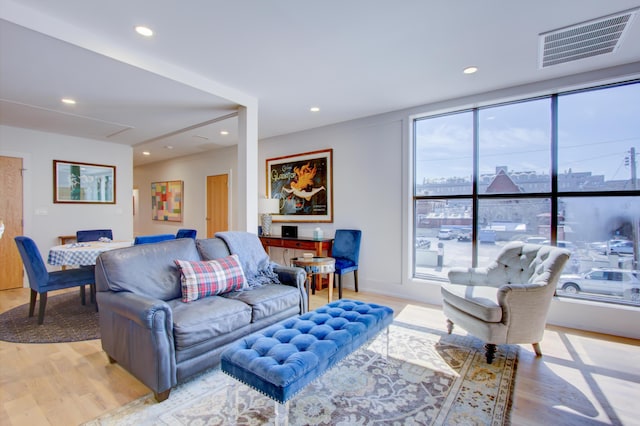 living room with light hardwood / wood-style flooring