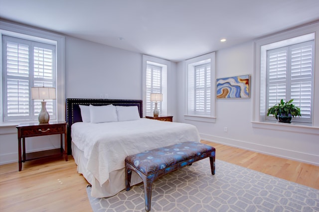 bedroom with light hardwood / wood-style flooring