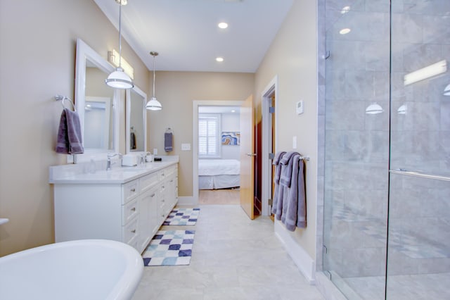 bathroom featuring vanity and independent shower and bath