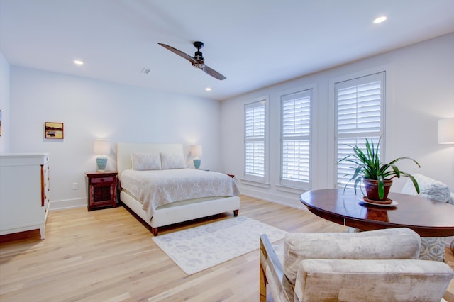 bedroom featuring ceiling fan and light hardwood / wood-style floors