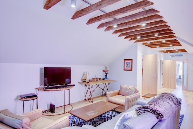 living room with lofted ceiling with beams and light hardwood / wood-style floors