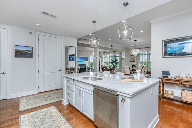 125 Pier View St Unit 408, Charleston, SC 29492 - kitchen featuring dishwasher, an island with sink, light wood finished floors, recessed lighting, and decorative light fixtures