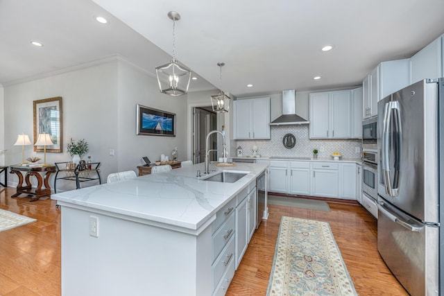 125 Pier View St Unit 408, Charleston, SC 29492 - kitchen with stainless steel appliances, wall chimney range hood, recessed lighting, crown molding, and light stone counters