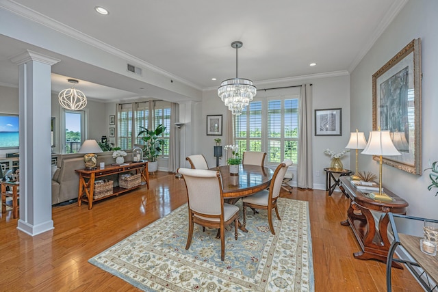 125 Pier View St Unit 408, Charleston, SC 29492 - dining space with a chandelier, plenty of natural light, ornate columns, recessed lighting, and wood finished floors