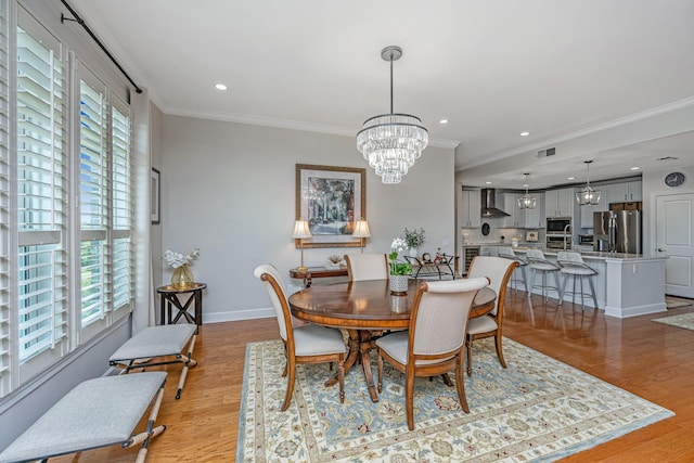 125 Pier View St Unit 408, Charleston, SC 29492 - dining space featuring crown molding, light wood-style floors, a chandelier, and recessed lighting