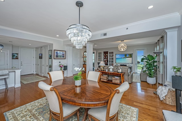 125 Pier View St Unit 408, Charleston, SC 29492 - dining area featuring light wood-style floors, a chandelier, ornamental molding, and recessed lighting