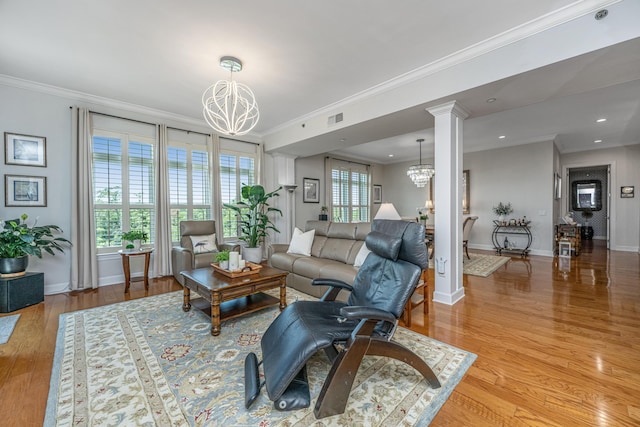 125 Pier View St Unit 408, Charleston, SC 29492 - living area with a chandelier, ornamental molding, light wood-type flooring, decorative columns, and recessed lighting