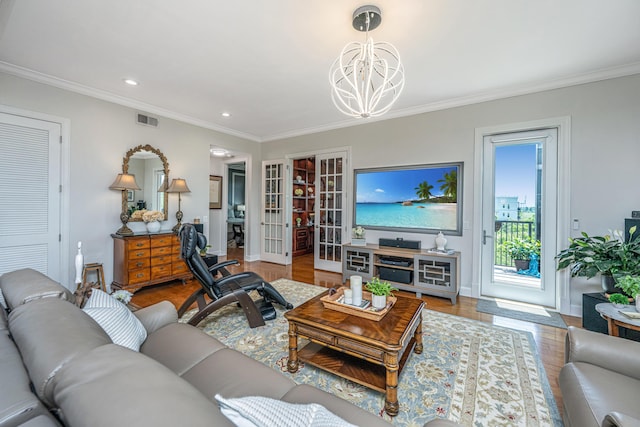 125 Pier View St Unit 408, Charleston, SC 29492 - living room with a chandelier, crown molding, wood finished floors, recessed lighting, and french doors