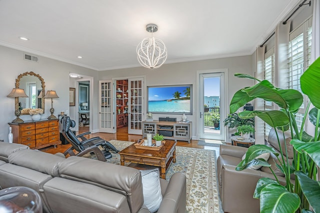 125 Pier View St Unit 408, Charleston, SC 29492 - living room with a chandelier, wood finished floors, french doors, ornamental molding, and recessed lighting