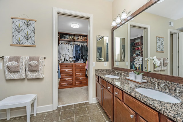 125 Pier View St Unit 408, Charleston, SC 29492 - bathroom featuring double vanity, a spacious closet, and tile patterned floors