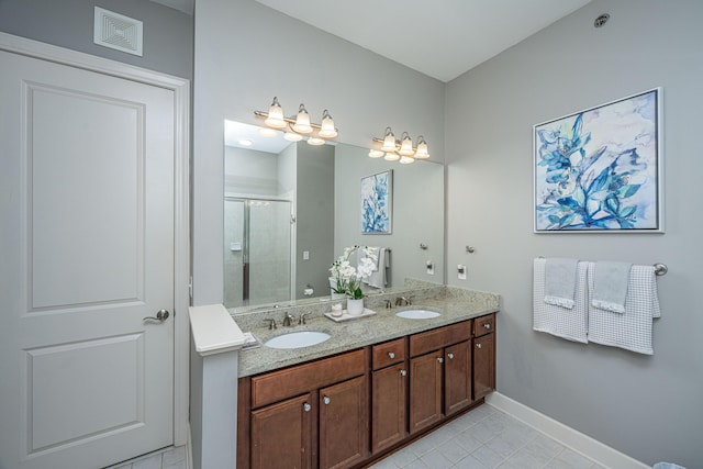 125 Pier View St Unit 408, Charleston, SC 29492 - bathroom with a shower stall, double vanity, and tile patterned floors