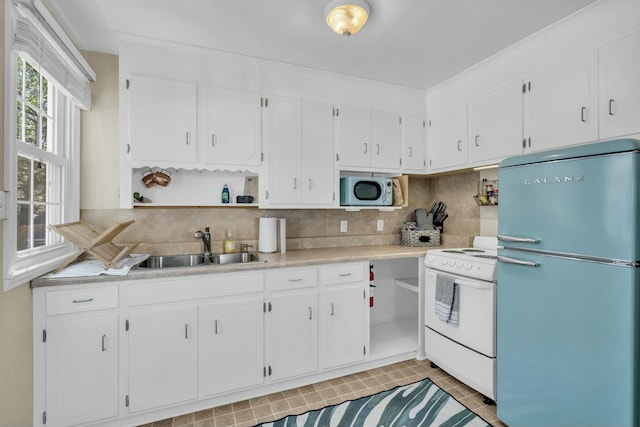 kitchen featuring open shelves, white appliances, a sink, and white cabinetry