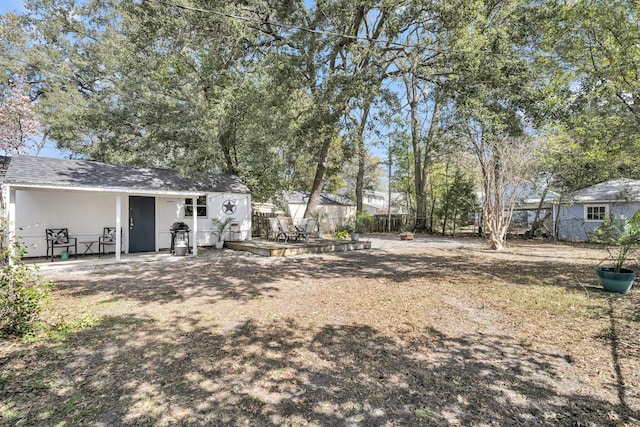 view of yard featuring a patio area and fence