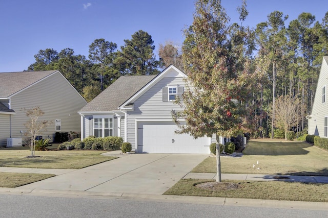 view of front of property featuring a garage, a front yard, concrete driveway, and central AC unit