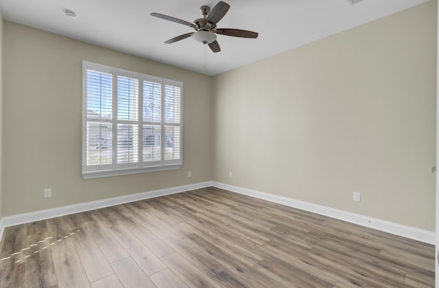 empty room featuring light hardwood / wood-style floors and ceiling fan