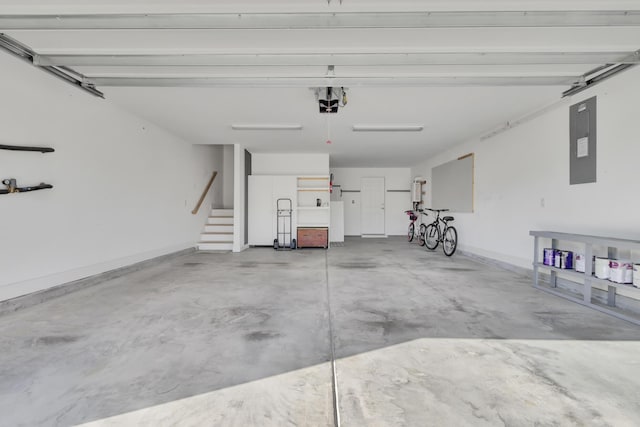 garage featuring a garage door opener and electric panel