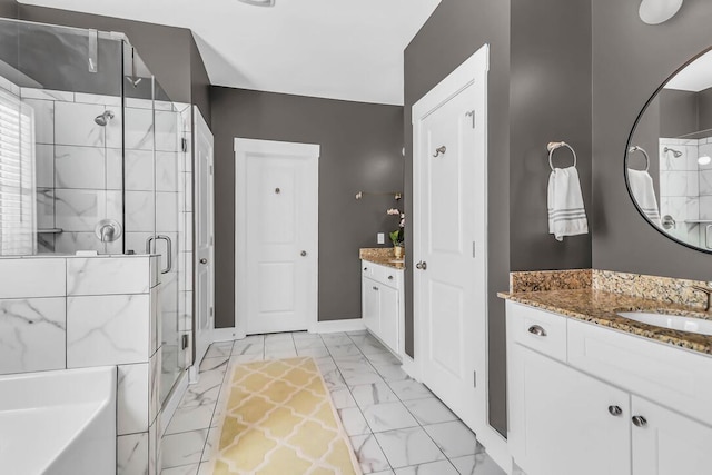 bathroom featuring an enclosed shower and vanity