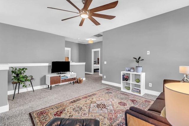 living room featuring carpet floors and ceiling fan