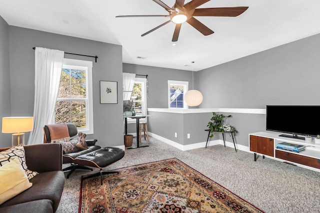 living room featuring carpet flooring and ceiling fan