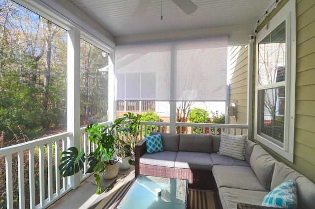 sunroom featuring ceiling fan