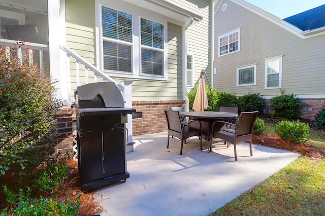 view of patio with a grill