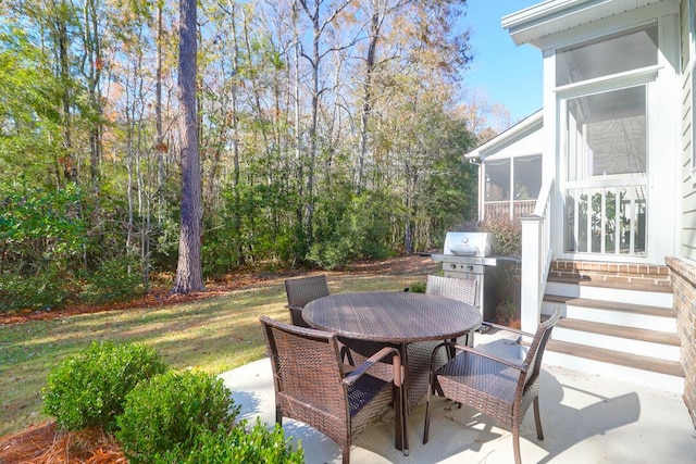 view of patio with a sunroom and grilling area