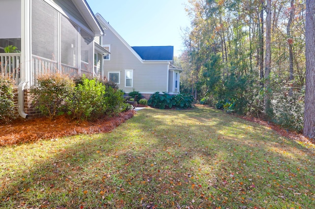 view of yard with a sunroom