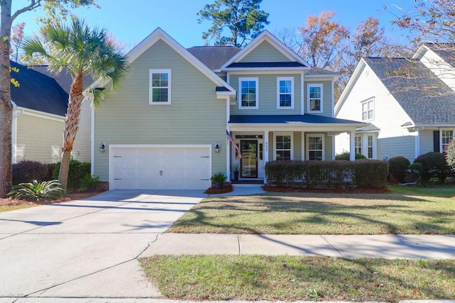 view of front facade with a garage, a front yard, and covered porch