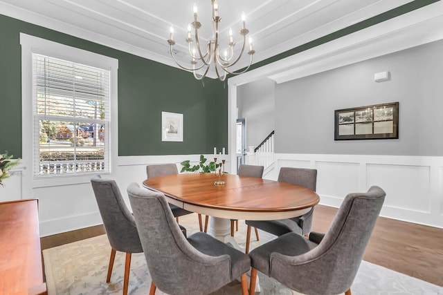 dining space featuring an inviting chandelier and hardwood / wood-style floors