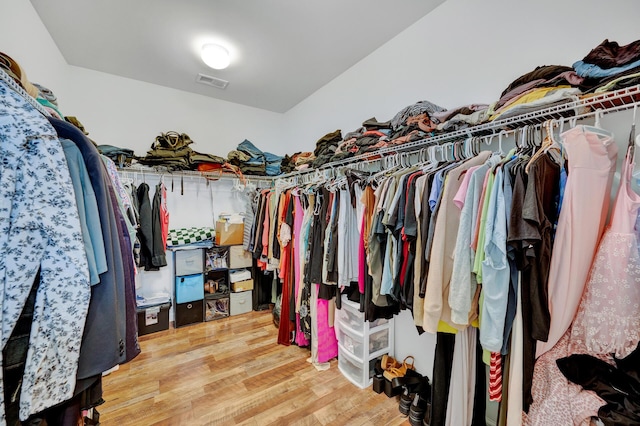 spacious closet with visible vents and wood finished floors