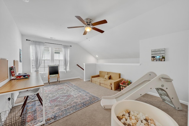 living room with carpet floors, lofted ceiling, visible vents, and baseboards