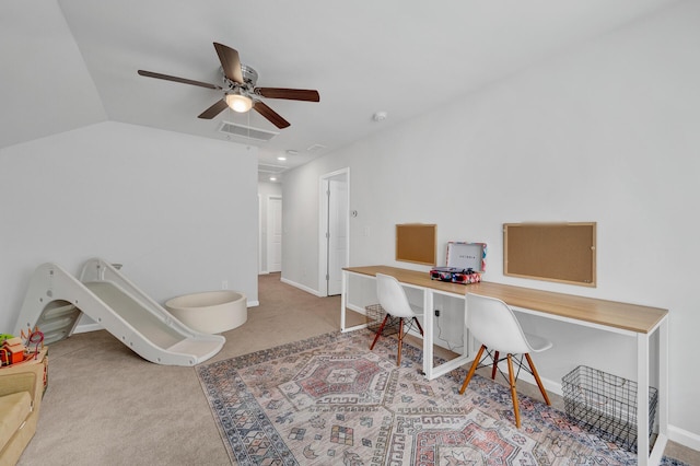 office area featuring baseboards, visible vents, lofted ceiling, ceiling fan, and carpet floors